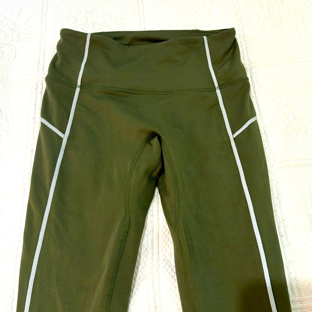 Free People You’re a peach leggings size small NWOT. Army green w silver thread
